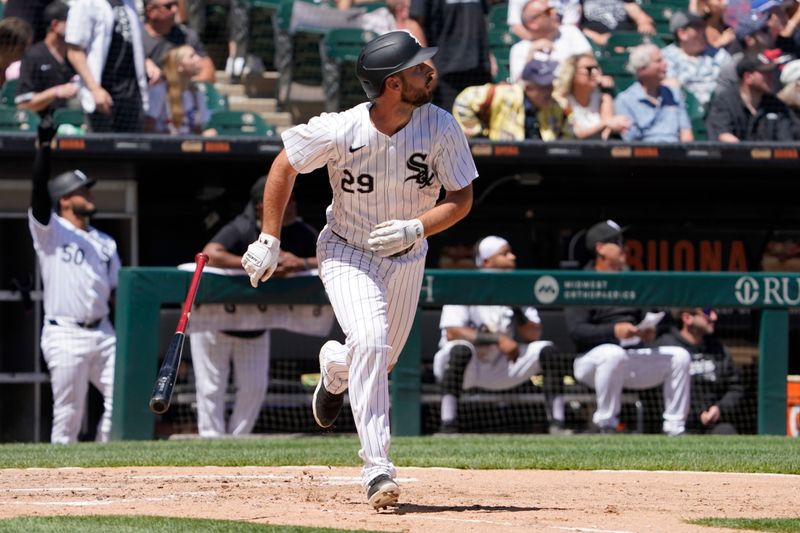 Jun 9, 2024; Chicago, Illinois, USA; Chicago White Sox shortstop Paul DeJong (29) hits a three-run home run against the Boston Red Sox during the fourth inning at Guaranteed Rate Field. Mandatory Credit: David Banks-USA TODAY Sports