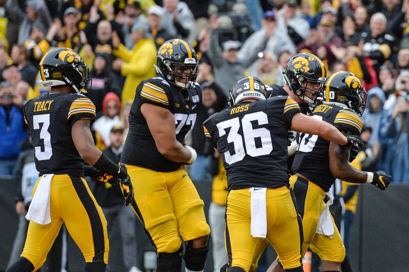 Oct 19, 2019; Iowa City, IA, USA; Iowa Hawkeyes running back Mekhi Sargent (10) celebrates with teammates after scoring a touchdown against the Purdue Boilermakers during the fourth quarter at Kinnick Stadium. Mandatory Credit: Jeffrey Becker-USA TODAY Sports