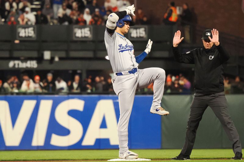 May 14, 2024; San Francisco, California, USA; Los Angeles Dodgers designated hitter Shohei Ohtani (17) gestures after hitting a RBI double against the San Francisco Giants during the seventh inning at Oracle Park. Mandatory Credit: Kelley L Cox-USA TODAY Sports