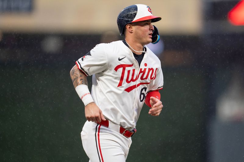 Jul 4, 2024; Minneapolis, Minnesota, USA; Minnesota Twins third base Jose Miranda (64) heads to home after catcher Ryan Jeffers (27) singles and there is an error on the play by the Detroit Tigers in the sixth inning at Target Field. Mandatory Credit: Matt Blewett-USA TODAY Sports