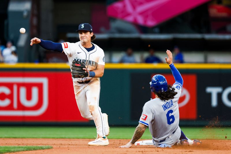 Jun 30, 2025; Seattle, Washington, USA; Seattle Mariners second baseman Cole Young (2) attempts to turn a double play against the Kansas City Royals during the eighth inning at T-Mobile Park. Mandatory Credit: Joe Nicholson-Imagn Images