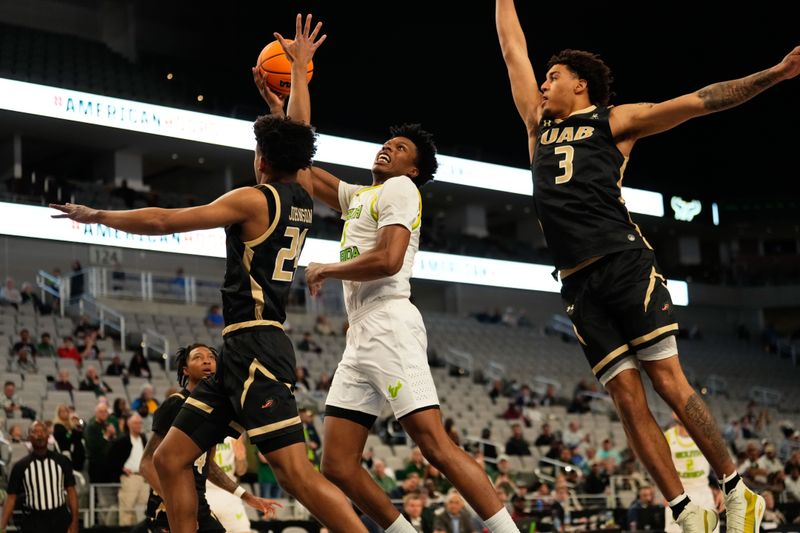 Mar 16, 2024; Fort Worth, TX, USA;  South Florida Bulls guard Brandon Stroud (5) shoots against UAB Blazers guard Efrem Johnson (24) during the first half at Dickies Arena. Mandatory Credit: Chris Jones-USA TODAY Sports