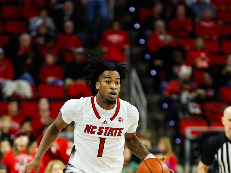 Dec 20, 2023; Raleigh, North Carolina, USA; North Carolina State Wolfpack guard Jayden Taylor (1) dribbles with the ball during the first half against Saint Louis at PNC Arena. Mandatory Credit: Jaylynn Nash-USA TODAY Sports