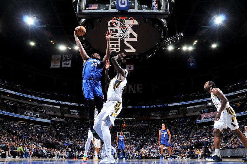 ORLANDO, FL - MARCH 10: Wendell Carter Jr. #34 of the Orlando Magic goes to the basket during the game on March 10, 2024 at Amway Center in Orlando, Florida. NOTE TO USER: User expressly acknowledges and agrees that, by downloading and or using this photograph, User is consenting to the terms and conditions of the Getty Images License Agreement. Mandatory Copyright Notice: Copyright 2024 NBAE (Photo by Fernando Medina/NBAE via Getty Images)