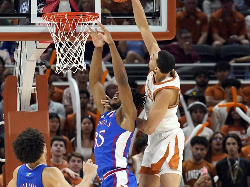 Mar 4, 2023; Austin, Texas, USA; Texas Longhorns forward Dylan Disu (1) attempts to dunk over Kansas Jayhawks forward Zuby Ejiofor (35) during the second half at Moody Center. Mandatory Credit: Scott Wachter-USA TODAY Sports