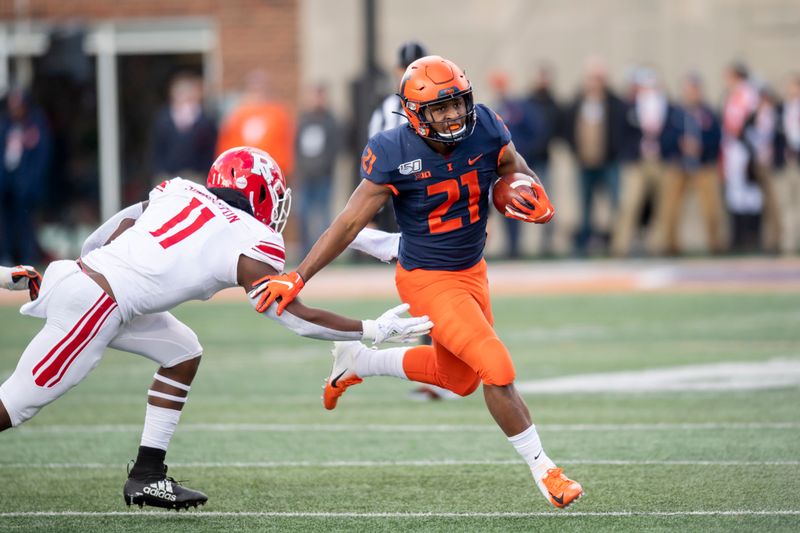 Nov 2, 2019; Champaign, IL, USA; Illinois Fighting Illini running back Ra'Von Bonner (21) runs the ball against Rutgers Scarlet Knights linebacker Drew Singleton (11) during the first half at Memorial Stadium. Mandatory Credit: Patrick Gorski-USA TODAY Sports