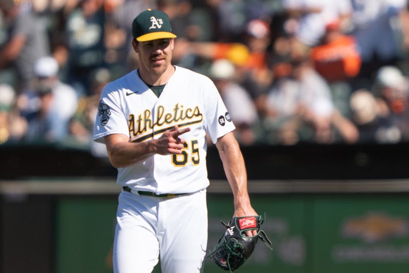 Aug 6, 2023; Oakland, California, USA;  Oakland Athletics relief pitcher Trevor May (65) reacts after defeating the San Francisco Giants at Oakland-Alameda County Coliseum. Mandatory Credit: Stan Szeto-USA TODAY Sports