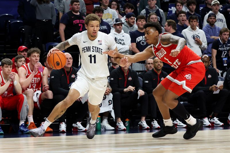 Mar 4, 2026; University Park, Pennsylvania, USA; Penn State Nittany Lions guard Eli Rice (11) drives the ball around the outside of Ohio State Buckeyes forward Amare Bynum (1) during the first half at Bryce Jordan Center. Mandatory Credit: Matthew O'Haren-Imagn Images