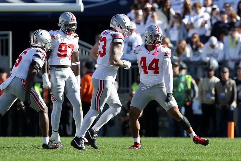 Nov 2, 2024; University Park, Pennsylvania, USA; Ohio State Buckeyes defensive end JT Tuimoloau (44) reacts following a sack on Penn State Nittany Lions quarterback Drew Allar (15) (not pictured) resulting in a fourth down during the third quarter at Beaver Stadium. Mandatory Credit: Matthew O'Haren-Imagn Images