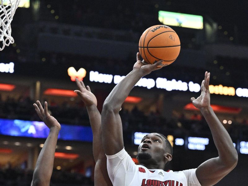 Jan 13, 2024; Louisville, Kentucky, USA;  Louisville Cardinals forward Brandon Huntley-Hatfield (5) shoots against North Carolina State Wolfpack forward DJ Burns Jr. (30) during the second half at KFC Yum! Center. Mandatory Credit: Jamie Rhodes-USA TODAY Sports