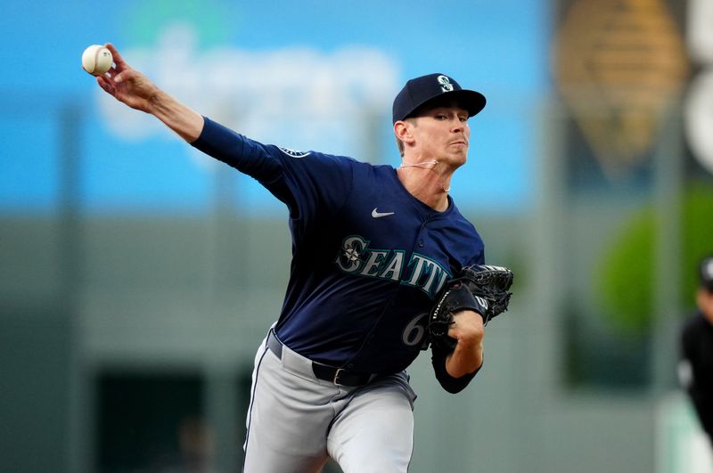 Apr 21, 2024; Denver, Colorado, USA; Seattle Mariners starting pitcher Emerson Hancock (62) delivers a pitch in the first inning against the Colorado Rockies at Coors Field. Mandatory Credit: Ron Chenoy-USA TODAY Sports