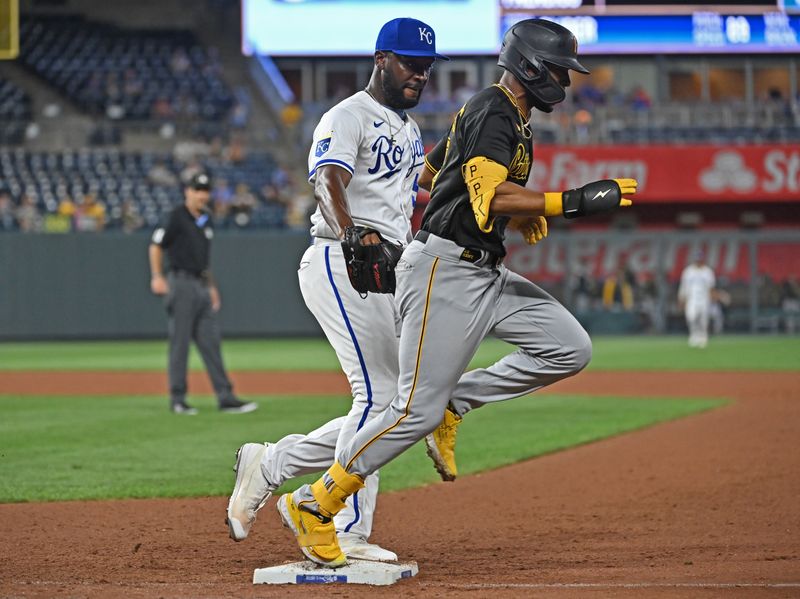 Aug 28, 2023; Kansas City, Missouri, USA;  Pittsburgh Pirates left fielder Joshua Palacios (54) beats Kansas City Royals relief pitcher Taylor Hearn (54) to first base for an RBI single in the seventh inning against at Kauffman Stadium. Mandatory Credit: Peter Aiken-USA TODAY Sports