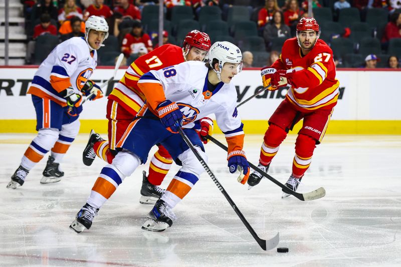 Jan 17, 2026; Calgary, Alberta, CAN; New York Islanders defenseman Matthew Schaefer (48) controls the puck against the Calgary Flames during the second period at Scotiabank Saddledome. Mandatory Credit: Sergei Belski-Imagn Images