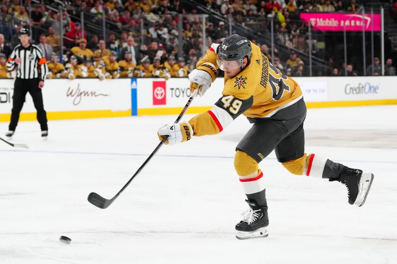 Feb 12, 2024; Las Vegas, Nevada, USA; Vegas Golden Knights center Ivan Barbashev (49) shoots against the Minnesota Wild during the third period at T-Mobile Arena. Mandatory Credit: Stephen R. Sylvanie-USA TODAY Sports