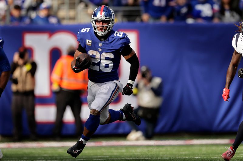 New York Giants running back Saquon Barkley (26) runs with the ball against the Houston Texans during an NFL football game Sunday, Nov. 13, 2022, in East Rutherford, N.J. (AP Photo/Adam Hunger)