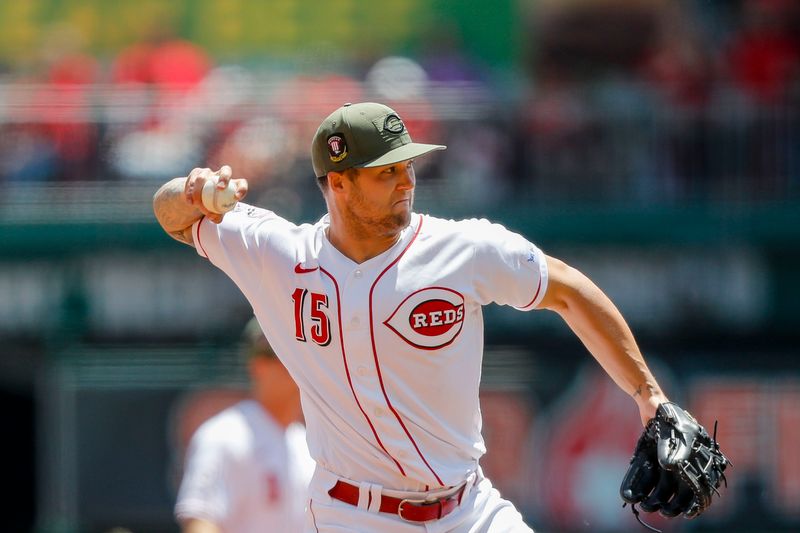 May 21, 2023; Cincinnati, Ohio, USA; Cincinnati Reds third baseman Nick Senzel (15) throws to first to get New York Yankees catcher Kyle Higashioka (not pictured) out in the sixth inning at Great American Ball Park. Mandatory Credit: Katie Stratman-USA TODAY Sports