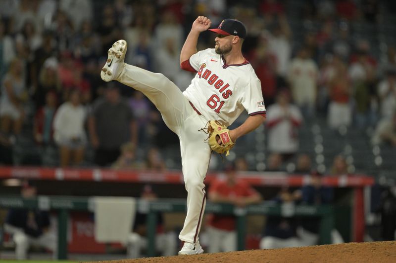 Jul 30, 2024; Anaheim, California, USA; Los Angeles Angels relief pitcher Hunter Strickland (61) earns a save in the ninth inning against the Colorado Rockies at Angel Stadium. Mandatory Credit: Jayne Kamin-Oncea-USA TODAY Sports