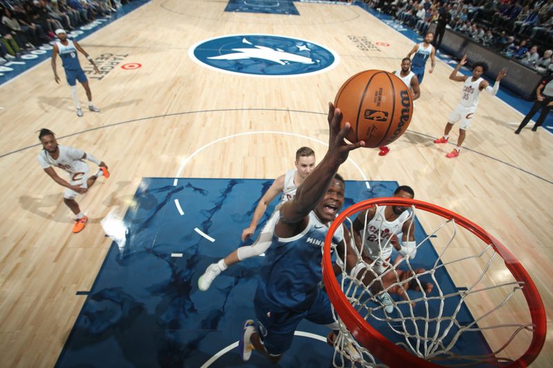 MINNEAPOLIS, MN -  MARCH 22: Anthony Edwards #5 of the Minnesota Timberwolves drives to the basket during the game against the Cleveland Cavaliers on March 22, 2024 at Target Center in Minneapolis, Minnesota. NOTE TO USER: User expressly acknowledges and agrees that, by downloading and or using this Photograph, user is consenting to the terms and conditions of the Getty Images License Agreement. Mandatory Copyright Notice: Copyright 2024 NBAE (Photo by Jordan Johnson/NBAE via Getty Images)