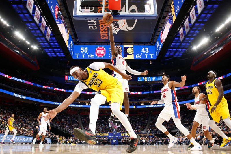 DETROIT, MI - OCTOBER 23: Jalen Duren #0 of the Detroit Pistons blocks shots during the game against the Indiana Pacers on October 23, 2024 at Little Caesars Arena in Detroit, Michigan. NOTE TO USER: User expressly acknowledges and agrees that, by downloading and/or using this photograph, User is consenting to the terms and conditions of the Getty Images License Agreement. Mandatory Copyright Notice: Copyright 2024 NBAE (Photo by Brian Sevald/NBAE via Getty Images)