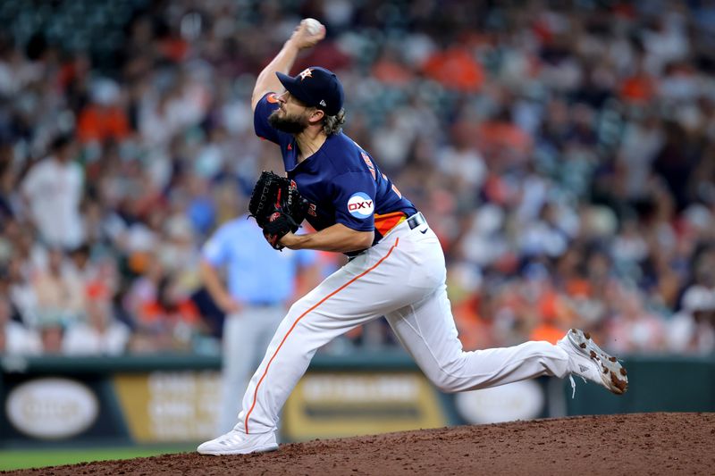 Jul 30, 2023; Houston, Texas, USA; Houston Astros relief pitcher Kendall Graveman (31) delivers a pitch against the Tampa Bay Rays during the eighth inning at Minute Maid Park. Mandatory Credit: Erik Williams-USA TODAY Sports