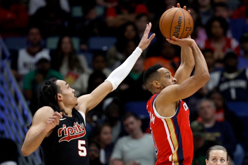 NEW ORLEANS, LOUISIANA - MARCH 16:  New Orleans Pelicans guard CJ McCollum #3 shoot over Portland Trail Blazers guard Dalano Banton #5 during the third quarter of an NBA game at Smoothie King Center on March 16, 2024 in New Orleans, Louisiana. NOTE TO USER: User expressly acknowledges and agrees that, by downloading and or using this photograph, User is consenting to the terms and conditions of the Getty Images License Agreement. (Photo by Sean Gardner/Getty Images)