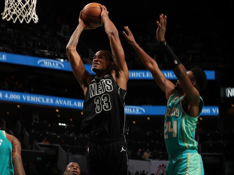 CHARLOTTE, NC - MARCH 9: Nicolas Claxton #33 of the Brooklyn Nets dunks the ball during the game against the Charlotte Hornets on March 9, 2024 at Spectrum Center in Charlotte, North Carolina. NOTE TO USER: User expressly acknowledges and agrees that, by downloading and or using this photograph, User is consenting to the terms and conditions of the Getty Images License Agreement. Mandatory Copyright Notice: Copyright 2024 NBAE (Photo by Kent Smith/NBAE via Getty Images)
