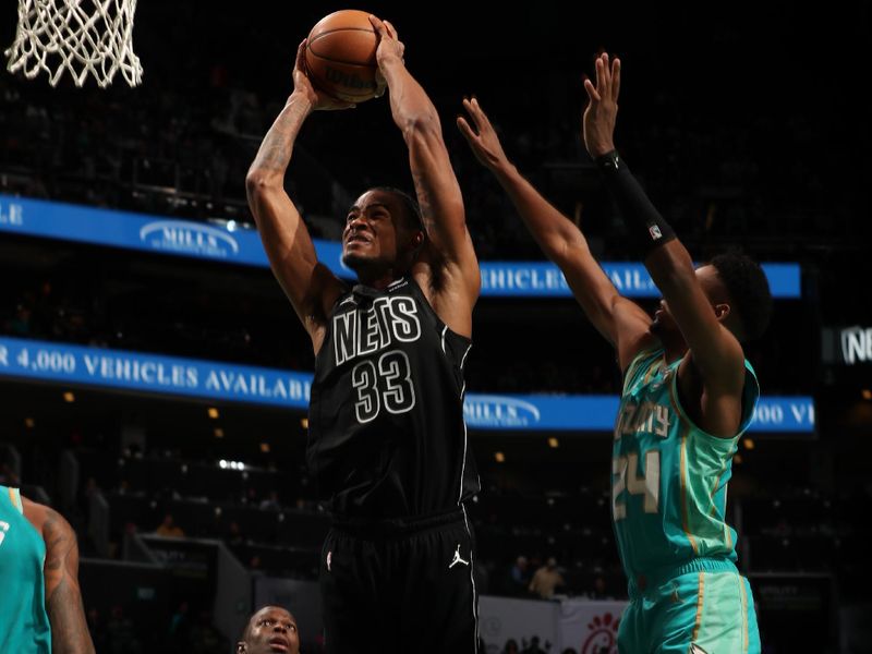 CHARLOTTE, NC - MARCH 9: Nicolas Claxton #33 of the Brooklyn Nets dunks the ball during the game against the Charlotte Hornets on March 9, 2024 at Spectrum Center in Charlotte, North Carolina. NOTE TO USER: User expressly acknowledges and agrees that, by downloading and or using this photograph, User is consenting to the terms and conditions of the Getty Images License Agreement. Mandatory Copyright Notice: Copyright 2024 NBAE (Photo by Kent Smith/NBAE via Getty Images)