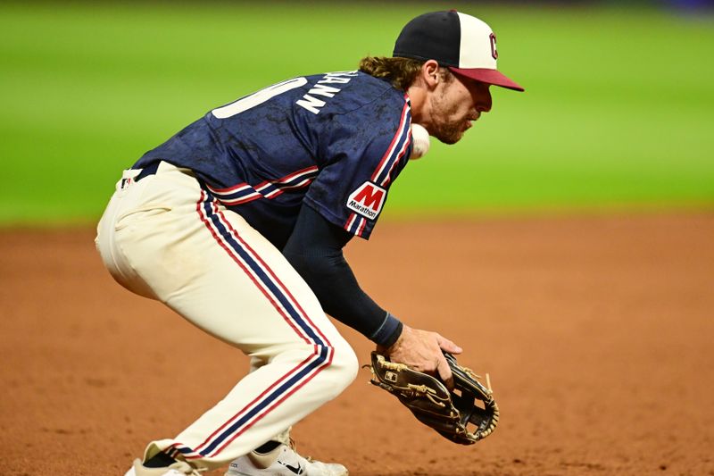 Aug 23, 2024; Cleveland, Ohio, USA; Cleveland Guardians third baseman Daniel Schneemann (10) makes an error on a hit by Texas Rangers third baseman Josh Jung (not pictured) during the sixth inning at Progressive Field. Mandatory Credit: Ken Blaze-USA TODAY Sports