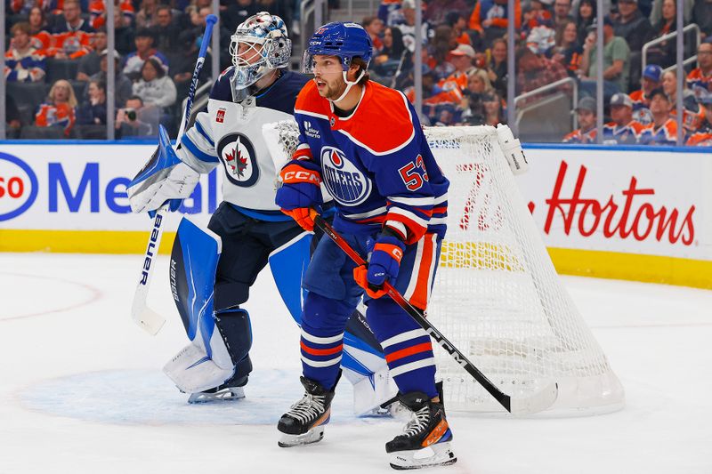 Sep 26, 2025; Edmonton, Alberta, CAN; Edmonton Oilers forward Issac Howard (53) looks for a pass in front of Winnipeg Jets goaltender Domenic DiVincentiis (50) during the first period at Rogers Place. Mandatory Credit: Perry Nelson-Imagn Images