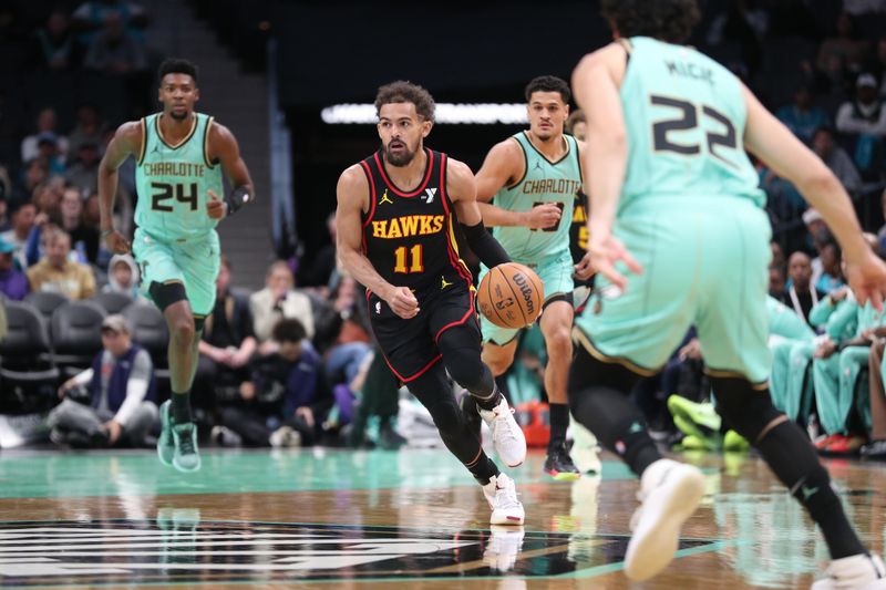 CHARLOTTE, NC - NOVEMBER 30: Trae Young #11 of the Atlanta Hawks drives to the basket during the game against the Charlotte Hornets on November 30, 2024 at Spectrum Center in Charlotte, North Carolina. NOTE TO USER: User expressly acknowledges and agrees that, by downloading and or using this photograph, User is consenting to the terms and conditions of the Getty Images License Agreement. Mandatory Copyright Notice: Copyright 2024 NBAE (Photo by Brock Williams-Smith/NBAE via Getty Images)