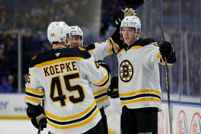 Jan 28, 2025; Buffalo, New York, USA;  Boston Bruins defenseman Mason Lohrei (6) celebrates his goal with teammates during the first period against the Buffalo Sabres at KeyBank Center. Mandatory Credit: Timothy T. Ludwig-Imagn Images