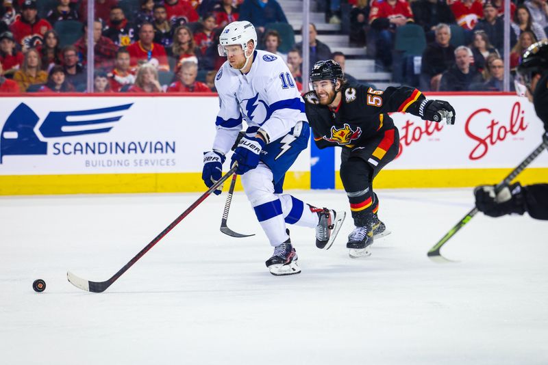 Jan 21, 2023; Calgary, Alberta, CAN; Tampa Bay Lightning right wing Corey Perry (10) controls the puck against the Calgary Flames during the third period at Scotiabank Saddledome. Mandatory Credit: Sergei Belski-USA TODAY Sports