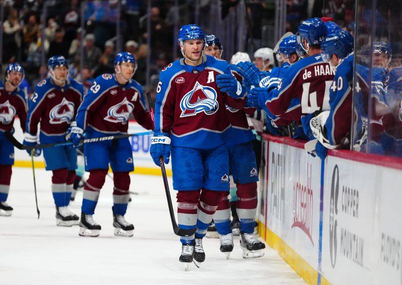 Nov 5, 2024; Denver, Colorado, USA; Colorado Avalanche right wing Mikko Rantanen (96) celebrates his empty net goal in the third period against the Seattle Kraken at Ball Arena. Mandatory Credit: Ron Chenoy-Imagn Images