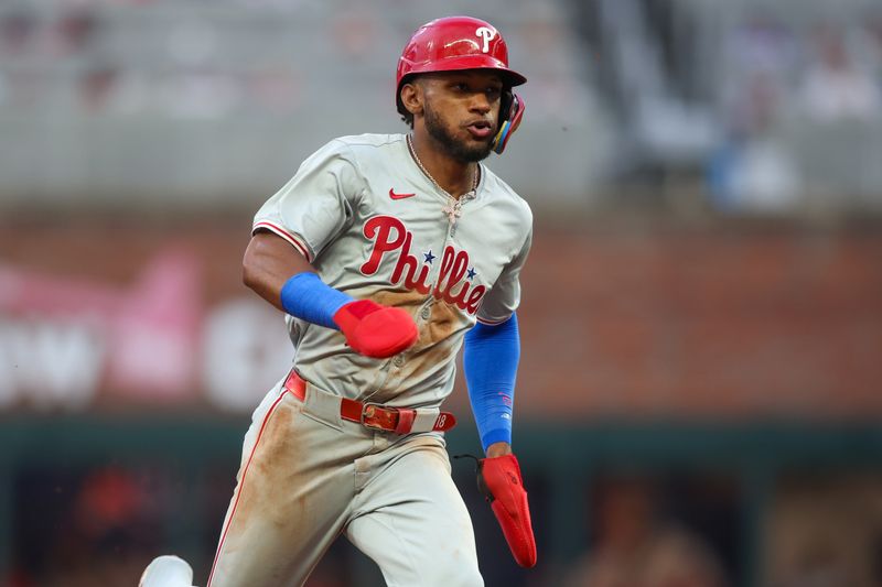 Jul 5, 2024; Atlanta, Georgia, USA; Philadelphia Phillies center fielder Johan Rojas (18) runs to third against the Atlanta Braves in the fourth inning at Truist Park. Mandatory Credit: Brett Davis-USA TODAY Sports