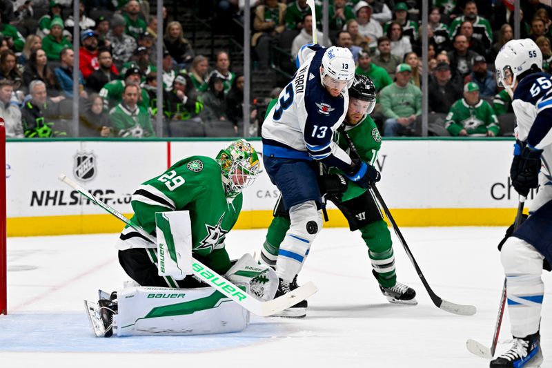 Feb 29, 2024; Dallas, Texas, USA; Dallas Stars goaltender Jake Oettinger (29) and center Joe Pavelski (16) and Winnipeg Jets center Sean Monahan (23) look for the puck in the Stars zone during the first period at the American Airlines Center. Mandatory Credit: Jerome Miron-USA TODAY Sports