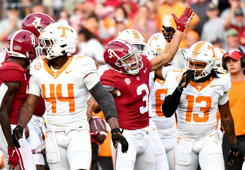 Oct 21, 2023; Tuscaloosa, Alabama, USA;  Alabama Crimson Tide wide receiver Jermaine Burton (3) celebrates amid Tennessee players after making a first down at Bryant-Denny Stadium. Alabama defeated Tennessee 34-20. Mandatory Credit: Gary Cosby Jr.-USA TODAY Sports