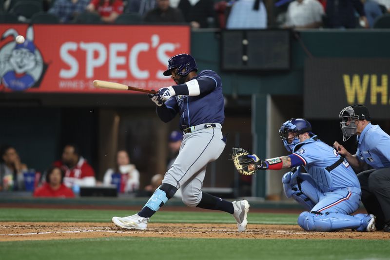 Apr 6, 2025; Arlington, Texas, USA; Tampa Bay Rays designated hitter Yandy Díaz (2) breaks his bat after hitting a ball in the fifth inning against the Texas Rangers at Globe Life Field. Mandatory Credit: Tim Heitman-Imagn Images