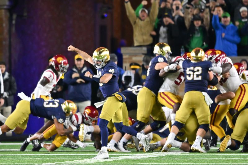 Oct 14, 2023; South Bend, Indiana, USA; Notre Dame Fighting Irish quarterback Sam Hartman (10) celebrates after an Irish touchdown in the second quarter against the USC Trojans at Notre Dame Stadium. Mandatory Credit: Matt Cashore-USA TODAY Sports