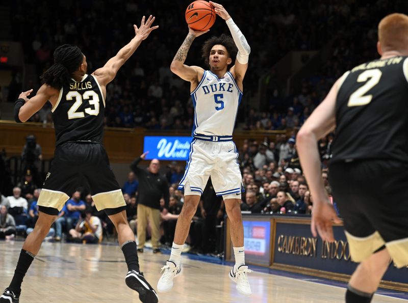 Feb 12, 2024; Durham, North Carolina, USA;  Duke Blue Devils guard Tyrese Proctor (5) shoots over Wake Forest Deamon Deacons guard Hunter Sallis (23) during the second half at Cameron Indoor Stadium. The Blue Devils won 77-69. Mandatory Credit: Rob Kinnan-USA TODAY Sports