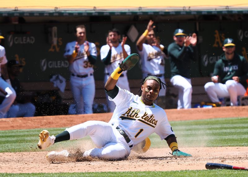 Jun 15, 2023; Oakland, California, USA; Oakland Athletics center fielder Esteury Ruiz (1) slides safely home against the Tampa Bay Rays during the fifth inning at Oakland-Alameda County Coliseum. Mandatory Credit: Kelley L Cox-USA TODAY Sports