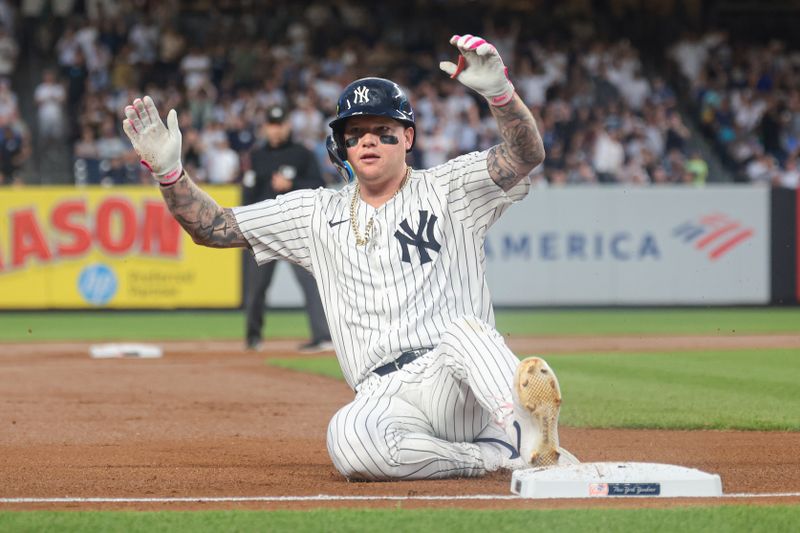 May 21, 2024; Bronx, New York, USA; New York Yankees left fielder Alex Verdugo (24) slides in top third base during the fourth inning against the Seattle Mariners at Yankee Stadium. Mandatory Credit: Vincent Carchietta-USA TODAY Sports