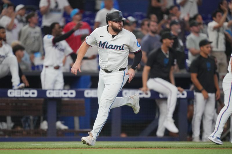 Jul 25, 2024; Miami, Florida, USA;  Miami Marlins third base Jake Burger (36) scores a run against the Baltimore Orioles in the ninth inning to tie the game at loanDepot Park. Mandatory Credit: Jim Rassol-USA TODAY Sports