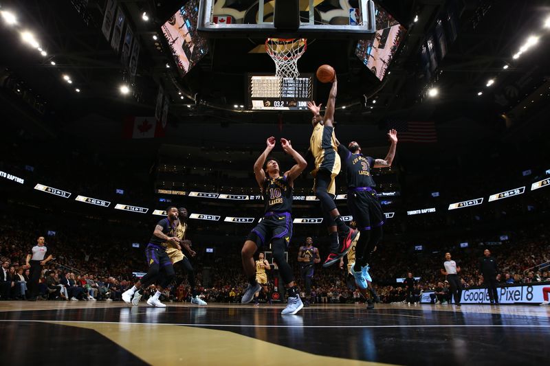 TORONTO, CANADA - APRIL 2: RJ Barrett #9 of the Toronto Raptors dunks the ball during the game against the Los Angeles Lakers on April 2, 2024 at the Scotiabank Arena in Toronto, Ontario, Canada.  NOTE TO USER: User expressly acknowledges and agrees that, by downloading and or using this Photograph, user is consenting to the terms and conditions of the Getty Images License Agreement.  Mandatory Copyright Notice: Copyright 2023 NBAE (Photo by Vaughn Ridley/NBAE via Getty Images)