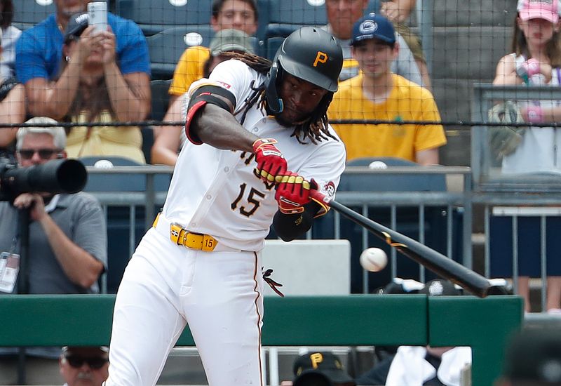 Jul 8, 2024; Pittsburgh, Pennsylvania, USA;  Pittsburgh Pirates shortstop Oneil Cruz (15) hits a single against the New York Mets during the sixth inning at PNC Park. The Pirates won 8-2.  Mandatory Credit: Charles LeClaire-USA TODAY Sports