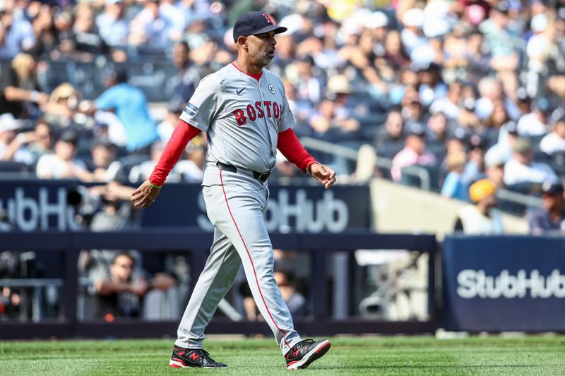 Sep 15, 2024; Bronx, New York, USA;  Boston Red Sox manager Alex Cora (13) comes out for a pitching change in the fifth inning against the New York Yankees at Yankee Stadium. Mandatory Credit: Wendell Cruz-Imagn Images