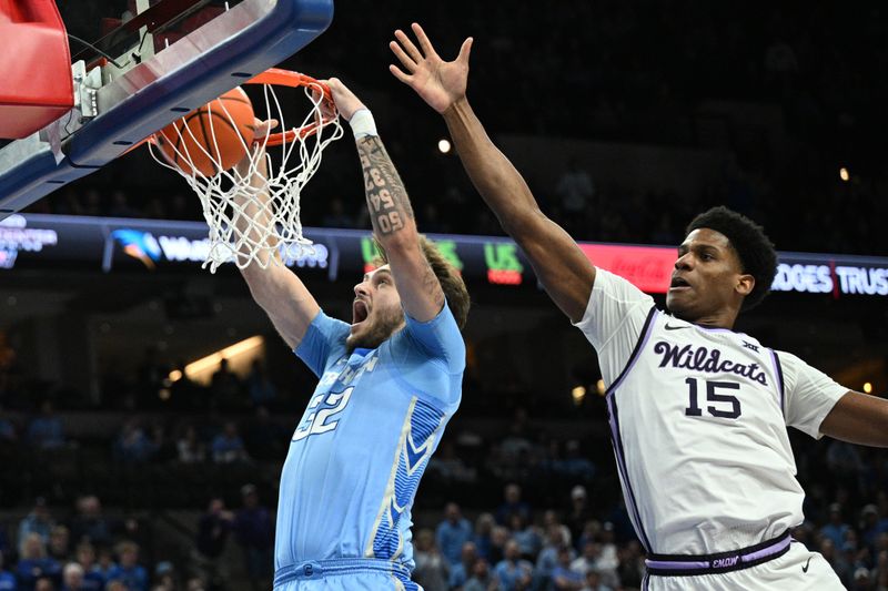 Dec 13, 2025; Omaha, Nebraska, USA;  Creighton Bluejays forward Owen Freeman (32) dunks against Kansas State Wildcats forward Taj Manning (15) during the second half at CHI Health Center Omaha. Mandatory Credit: Steven Branscombe-Imagn Images