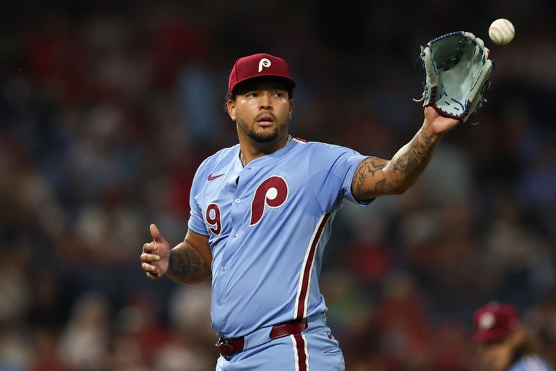 Sep 25, 2025; Philadelphia, Pennsylvania, USA; Philadelphia Phillies pitcher Taijuan Walker (99) catches a ball as he prepares to pitch during the sixth inning against the Miami Marlins at Citizens Bank Park. Mandatory Credit: Bill Streicher-Imagn Images