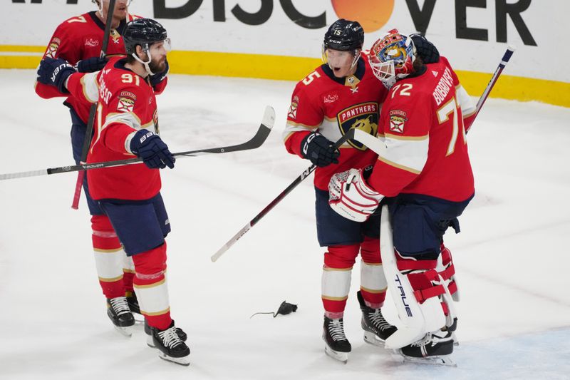 Jun 1, 2024; Sunrise, Florida, USA; Florida Panthers goaltender Sergei Bobrovsky (72) is congratulated by center Anton Lundell (15) following a close-out victory against the New York Rangers in game six of the Eastern Conference Final of the 2024 Stanley Cup Playoffs at Amerant Bank Arena. Mandatory Credit: Jim Rassol-USA TODAY Sports