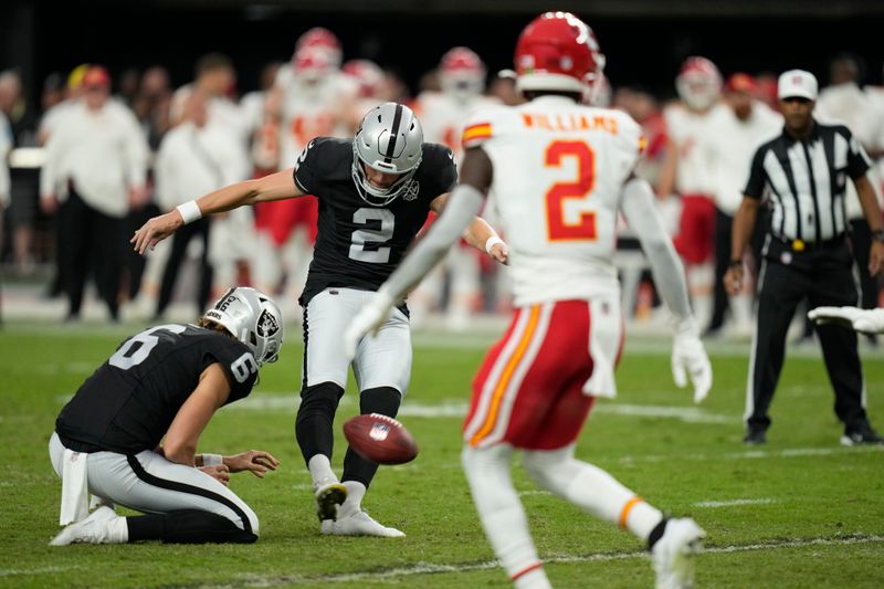 Las Vegas Raiders place-kicker Daniel Carlson (2) makes a 32-yard field goal during the second half of an NFL football game against the Kansas City Chiefs Sunday, Oct. 27, 2024, in Las Vegas. (AP Photo/John Locher)