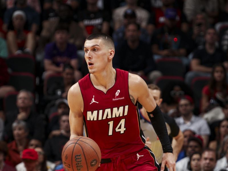 MIAMI, FL - NOVEMBER 29: Tyler Herro #14 of the Miami Heat dribbles the ball during the game against the Toronto Raptors in the NBA Cup on November 29, 2024 at Kaseya Center in Miami, Florida. NOTE TO USER: User expressly acknowledges and agrees that, by downloading and or using this Photograph, user is consenting to the terms and conditions of the Getty Images License Agreement. Mandatory Copyright Notice: Copyright 2024 NBAE (Photo by Issac Baldizon/NBAE via Getty Images)